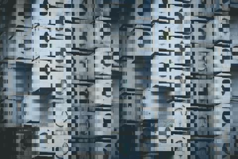 Stacks of square metal cubes with round window