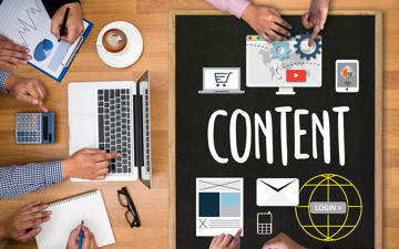 People sitting sround table brainstorming around content