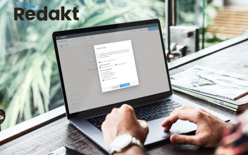 Macbook screen with Redakt import content dialog